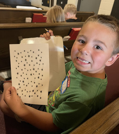 crafts - child connects stars to make a constellation