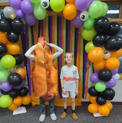 costumed kids pose for pictures