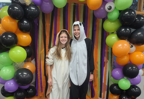 costumed kids pose for pictures