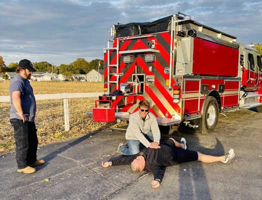 fire department giving CPR